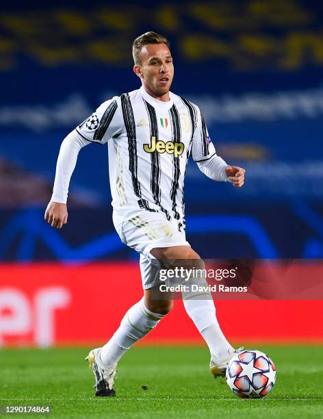 Arthur Melo of Juventus runs with the ball during the UEFA Champions League Group G stage match between FC Barcelona and Juventus at Camp Nou on...