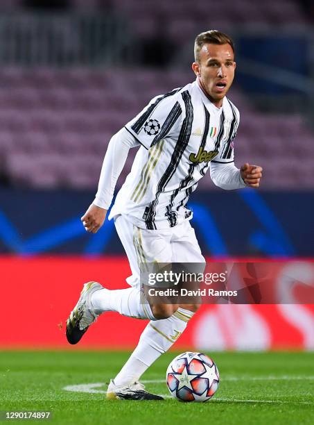 Arthur Melo of Juventus runs with the ball during the UEFA Champions League Group G stage match between FC Barcelona and Juventus at Camp Nou on...