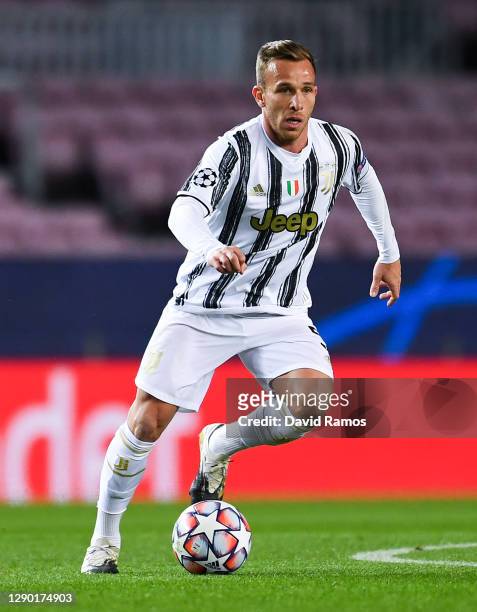 Arthur Melo of Juventus runs with the ball during the UEFA Champions League Group G stage match between FC Barcelona and Juventus at Camp Nou on...