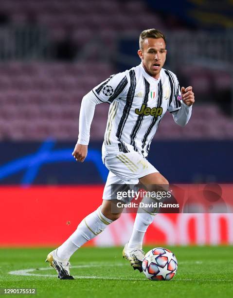 Arthur Melo of Juventus runs with the ball during the UEFA Champions League Group G stage match between FC Barcelona and Juventus at Camp Nou on...