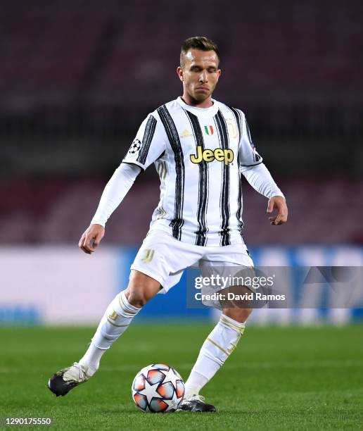 Arthur Melo of Juventus runs with the ball during the UEFA Champions League Group G stage match between FC Barcelona and Juventus at Camp Nou on...