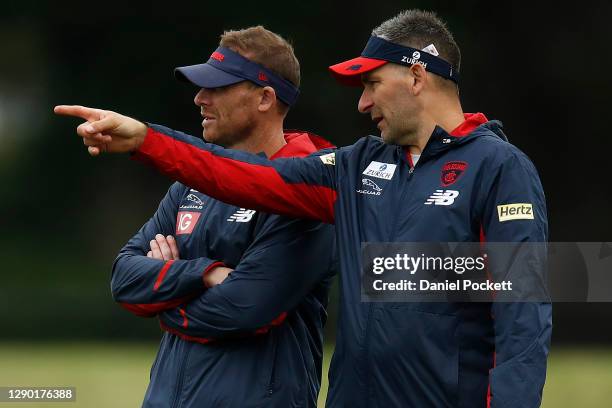 Demons assistant coach Adem Yze speaks with Demons head coach Simon Goodwin during a Melbourne Demons AFL training session at Casey Fields on...