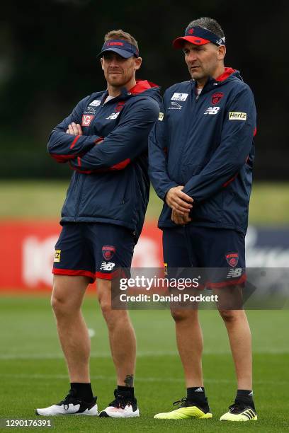 Demons assistant coach Adem Yze speaks with Demons head coach Simon Goodwin during a Melbourne Demons AFL training session at Casey Fields on...
