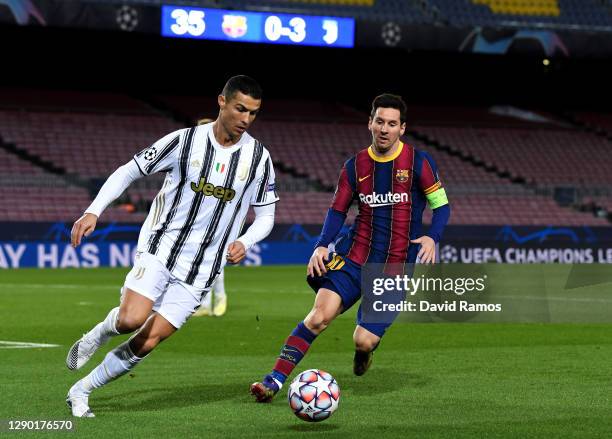 Cristiano Ronaldo of Juventus F.C. Is put under pressure by Lionel Messi of Barcelona during the UEFA Champions League Group G stage match between FC...