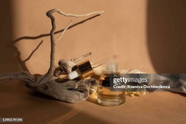 composition with bottles of essential oils on table. natural cosmetics - antiseptic cream stock pictures, royalty-free photos & images