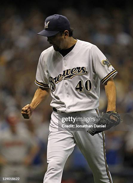 Takashi Saito of the Milwaukee Brewers celebrates after pitching against the Arizona Diamondbacks during Game Five of the National League Division...