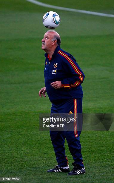 Spain's coach Vicente del Bosque controls a ball during a training session in Alicante on October 10 on the eve of their Euro 2012 qualifying match...
