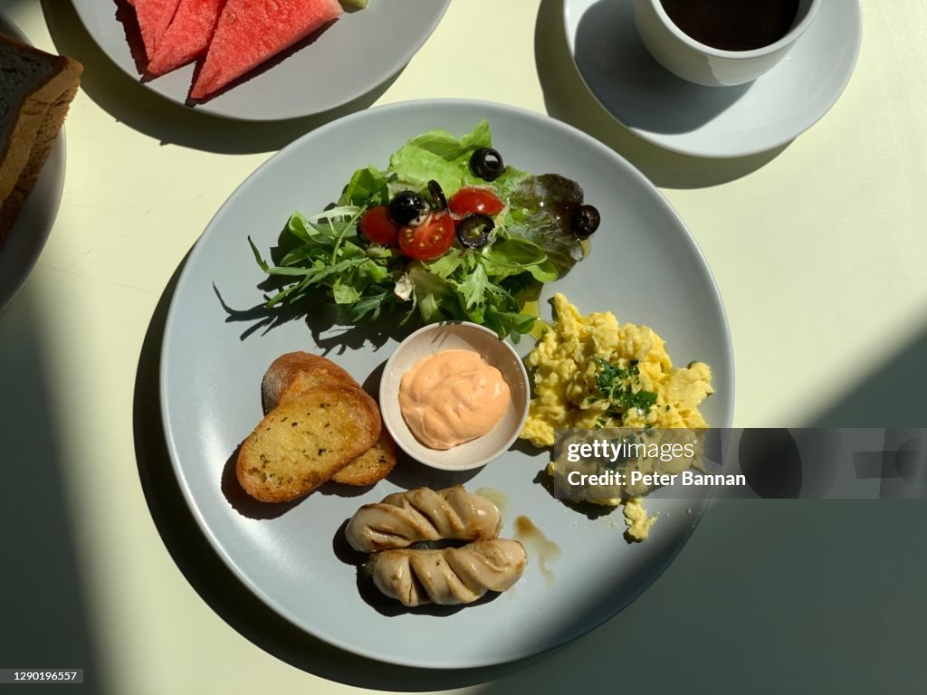 Breakfast platter on tabletop in sunlight