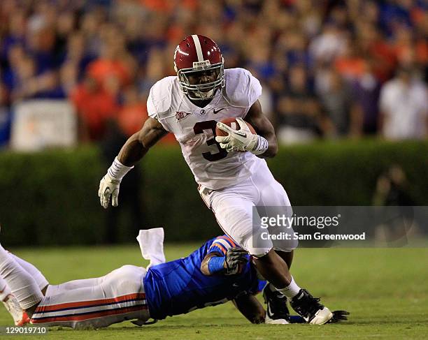 Trent Richardson of the Alabama Crimson Tide runs for yardage during a game against the Florida Gators at Ben Hill Griffin Stadium on October 1, 2011...