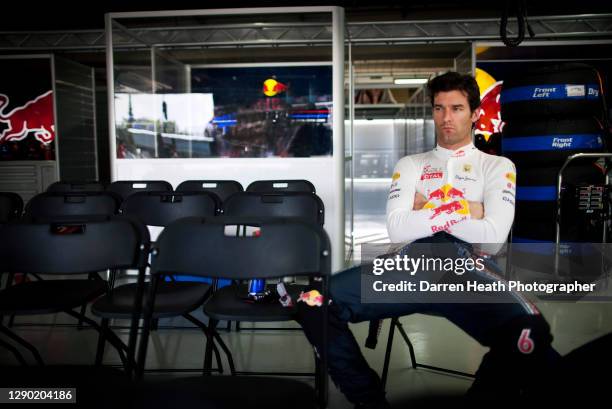 Australian Red Bull Racing Formula One racing driver Mark Webber sitting in the Red Bull Racing pit garage before the 2010 Brazilian Grand Prix,...