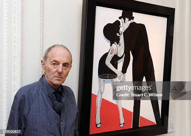 Gerald Laing poses next to one of his creations during the private launch of Amy Winehouse: A Memorial Exhibition at Thomas Gibson Fine Art on...