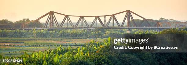 long bien bridge in sunset - hanoi cityscape stock pictures, royalty-free photos & images