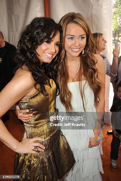 Actress Demi Lovato and actress Miley Cyrus arrive at Nickelodeon's 2009 Kids' Choice Awards at UCLA's Pauley Pavilion on March 28, 2009 in Westwood,...