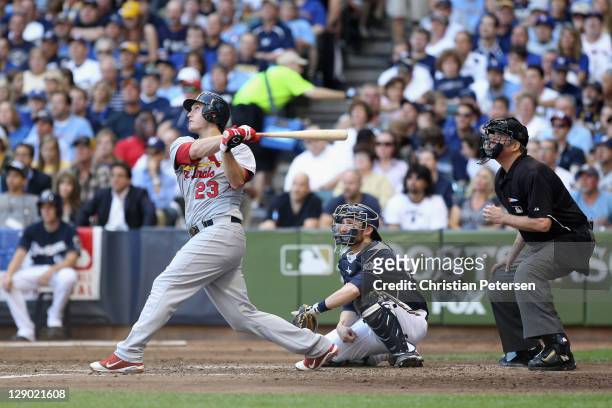 David Freese of the St. Louis Cardinals hits a 3-run home run in the top of the fourth inning against the Milwaukee Brewers during Game one of the...