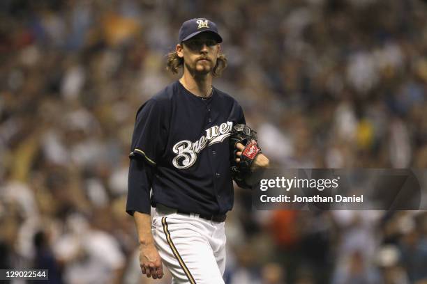 John Axford of the Milwaukee Brewers looks on against the St. Louis Cardinals during Game one of the National League Championship Series at Miller...