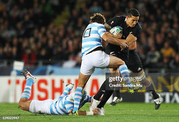 Sonny Bill Williams of the All Blacks is tackled by Santiago Fernandez of Argentina during quarter final four of the 2011 IRB Rugby World Cup between...