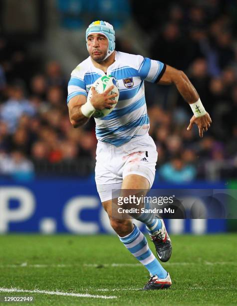 Juan Manuel Leguizamon of Argentina breaks clear during quarter final four of the 2011 IRB Rugby World Cup between New Zealand and Argentina at Eden...