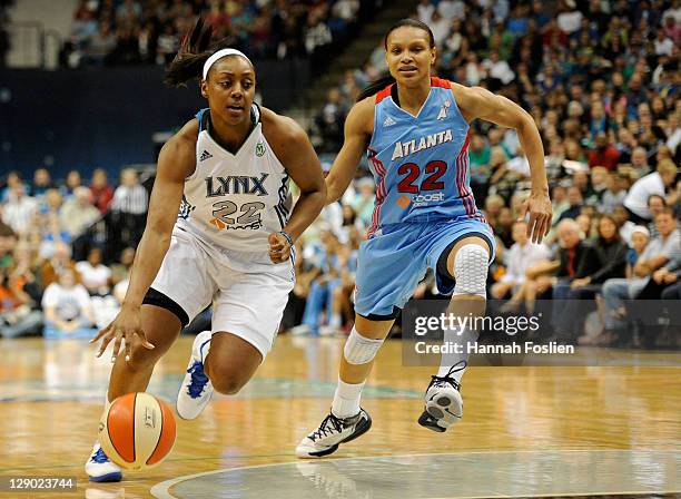 Armintie Price of the Atlanta Dream defends against Monica Wright of the Minnsota Lynx in Game One of the 2011 WNBA Finals on October 2, 2011 at...