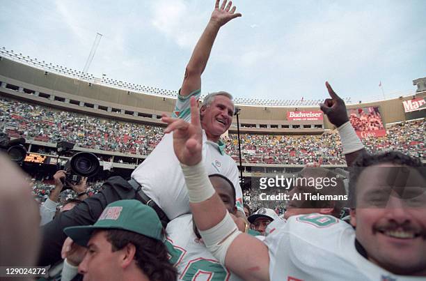 Miami Dolphins head coach Don Shula victorious being carried by players after winning 325th game of his career vs Philadelphia Eagles at Veterans...