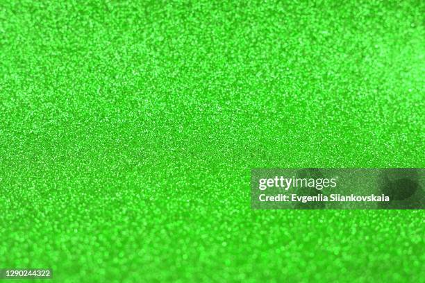 bright sparkle green background. holiday and festive concept. - skin diamond stock pictures, royalty-free photos & images