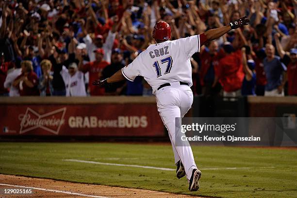 Nelson Cruz of the Texas Rangers runs the bases after hitting a walk off grand slam home run in the bottom of the 11th inning to win Game Two of the...