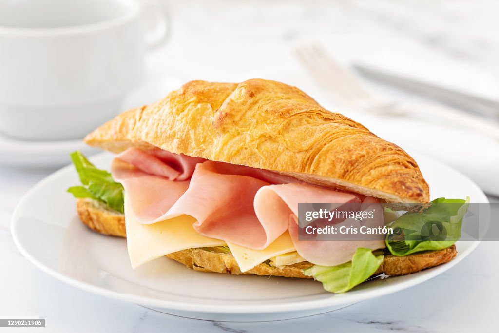 Croissant sandwich with ham and cheese