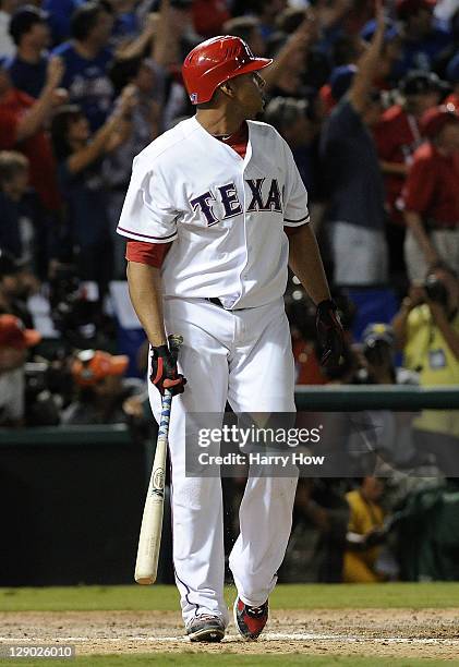 Nelson Cruz of the Texas Rangers watches his walk off grand slam home run in the bottom of the 11th inning to win Game Two of the American League...