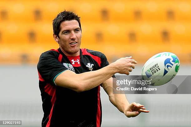 Utility back James Hook passes the ball during a Wales IRB Rugby World Cup 2011 training session at Mt Smart Stadium on October 11, 2011 in Auckland,...