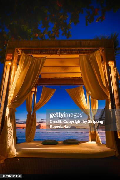 seaside cabana at dusk - beach hut fotografías e imágenes de stock