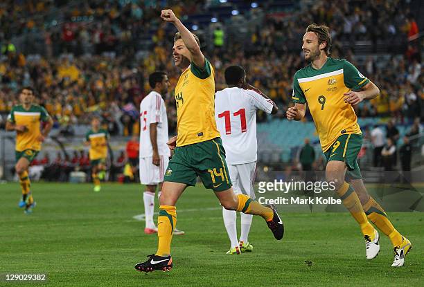 Brett Holman of the Socceroos celebrates after scoring a goal during the FIFA World Cup Asian Qualifier match between the Australian Socceroos and...