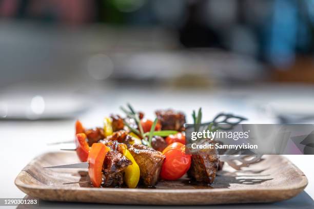 close-up of beef ribs kebabs on the plate - grilled vegetables stock pictures, royalty-free photos & images