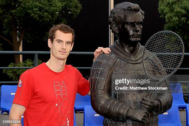 Andy Murray of Great Britain poses for photographers at the unvieling of a statue of his likeness as a terra cotta warrior during the Shanghai Rolex...