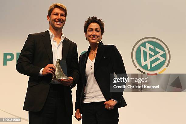 Thomas Hitzlsperger, presents the honorary prize of the Julius Hirsch Award with moderator Dunja Hayali during the Julius Hirsch Award 2011 at the...