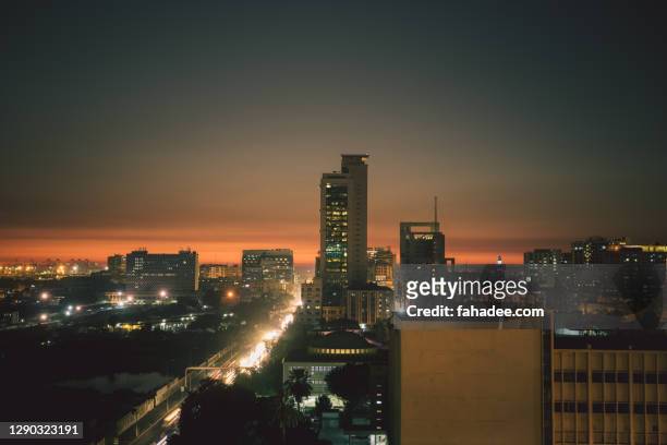 karachi largest city of pakistan after sunset - pakistan skyline stock pictures, royalty-free photos & images