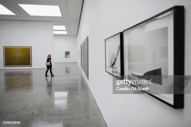 Member of the public views paintings exhibited in the new White Cube gallery in Bermondsey on October 11, 2011 in London, England. The third White...