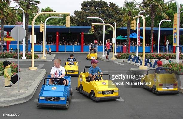Youngsters take the wheel at Driving School at Legoland California, near San Diego. On October 15 its sister park will open in Winter Haven, about 40...