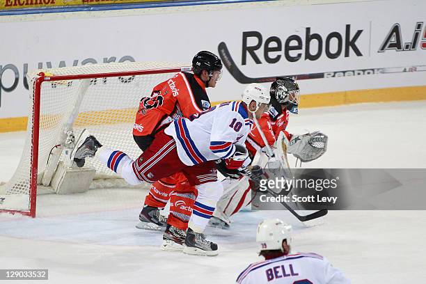 Marian Gaborik of the New York Rangers battles for position in front of the net with Timo Helblng of EV Zug at the Bossard Arena during the 2011 NHL...