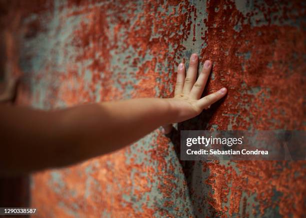 touching turkish rugs and carpet with national patterns. background from textile. turkish carpet shop. - touching fabric stock pictures, royalty-free photos & images