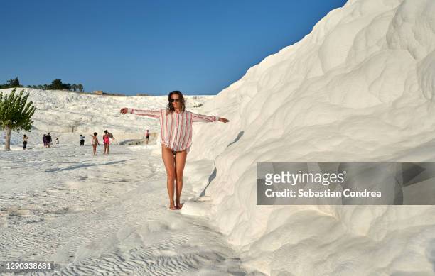 young woman flying enjoying pamukkale, turkey - geology work stock pictures, royalty-free photos & images