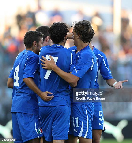Alessandro Saponara of Italy celebrates with teammates after scoring the opening goal of the UEFA European Under-21 Championship qualifying match...