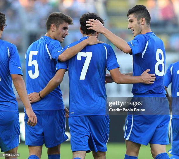 Alessandro Saponara italy celebrates with team-mates after scoring the opening goal of the UEFA European Under-21 Championship qualifying match...