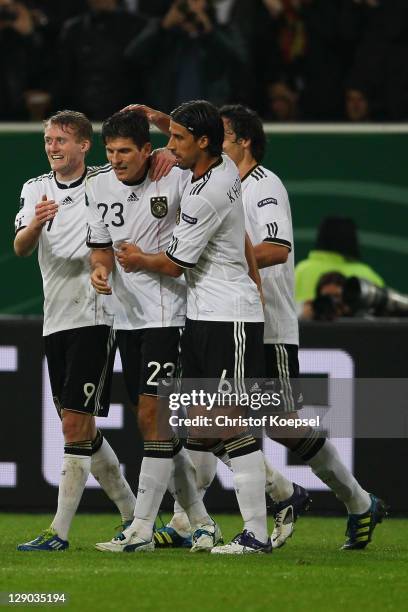 Andre Schuerrle celebrates the second goal with Mario Gomez, Sami Khedria and Mats Hummels of Germany during the UEFA EURO 2012 Group A qualifying...