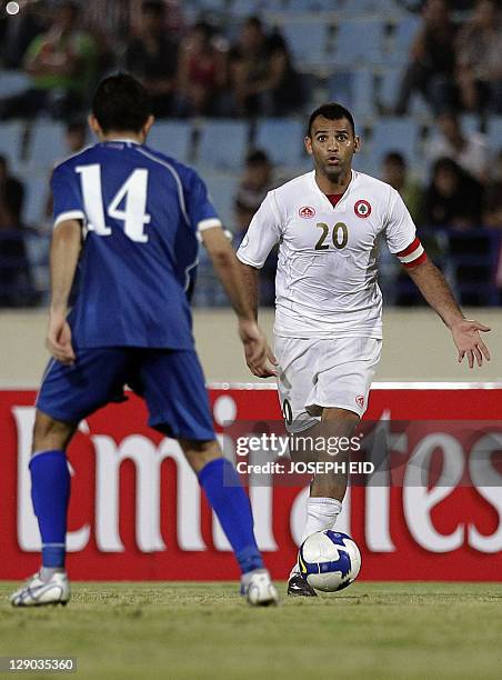 Lebanon's Midlfielder and Captain Roda Antar kicks the ball during their 2014 World Cup Asian zone qualifying football match in Beirut, on October...