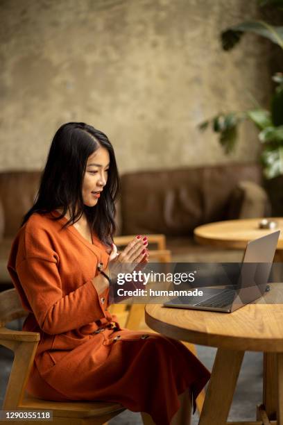 beautiful asian woman looking for work online - zoom interview stock pictures, royalty-free photos & images