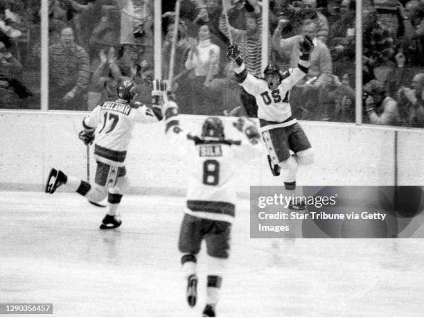 Team USA's Mark Johnson, right, celebrates one of his two goals vs. The Soviet Union during a medal round game at the 1980 Winter Olympics in Lake...