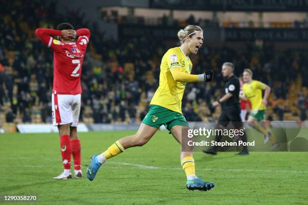 Todd Cantwell of Norwich City celebrates their team's second goal scored by Emi Buendia of Norwich City during the Sky Bet Championship match between...