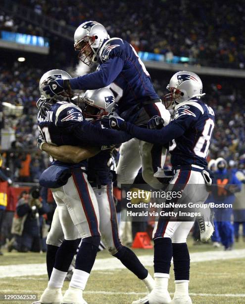 Playoffs: New England Patriots vs. Tennessee Titana at Gillette Stadium. The Pats' Troy Brown jumps on teamates after they scored in the first...