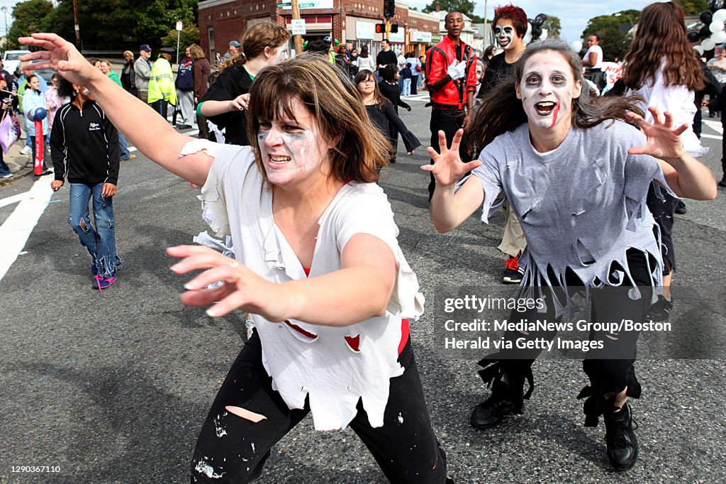 (100310 Boston, MA) "Zombies," including Melissa Cadman of Millis, right, dance to Michael Jackson's "Thriller" during the Roslindale Day Parade, Sunday, October 03, 2010. Staff photo by Angela Rowlings.