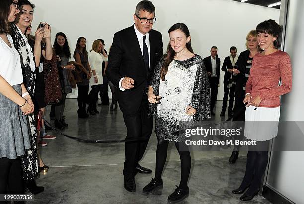 Jay Jopling helps daughter Angelica cut the ribbon at the opening of the new White Cube Bermondsey gallery on October 11, 2011 in London, England.