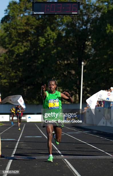 Top male finisher Ali Abdosh, of Ethiopia crosses the finish line. The Boston Athletic Association 2011 Half Marathon kicked off at 8:30 a.m. In...